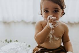 Cake smash!! It took this little one a bit to warm up to the idea and then  by the end everyone was in