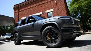 Rivian reduces 2026 spending plans, narrows earnings guidance
