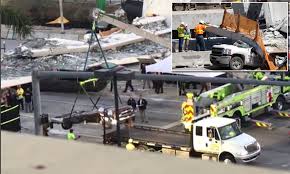 More on miami bridge collapse: Rescuers Remove Vehicles Flattened After A Miami Bridge Collapse Daily Mail Online
