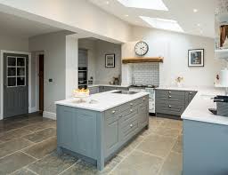 For subtle contrast, two different shades of the same calm colour tend to work better on cabinetry than three or four, which can look like a design mistake. Painted Mid Grey Shaker Kitchen Cabinets With White Quartz Worktops Grey Shaker Kitchen Cheap Kitchen Units White Shaker Kitchen Cabinets