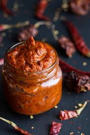 Homemade Harissa Spicy Red Pepper Sauce Half Baked Harvest Recipe In 2020 Red Pepper Sauce Stuffed Peppers Homemade Condiments