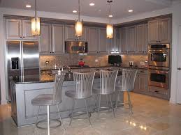 Metallic Paint Colours For Kitchen Cupboards Stained Kitchen Cabinets Kitchen Cabinet Design Metal Kitchen Cabinets
