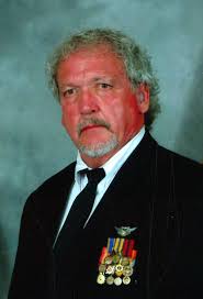 Raymond “Gene” White, DVM.