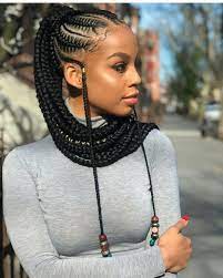 These cornrows twist in a circular design; 47 Of The Most Inspired Cornrow Hairstyles For 2021