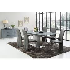 Crafted of walnut veneer, the table epitomizes the clean lines of modern design with a streamlined beveled top. Extendable Dining Table Set Grey Erigiestudio