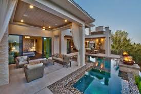 Also, a 32 x 16 wooden pergola attached to the house with a customized wooden wall for the tv on a structured bench with the same finishes matching the outdoor kitchen. Indoor Outdoor Living Space Luxury Indoor Outdoor Living Space Saterdesign Luxury House Plans Outdoor Kitchen Design Contemporary Patio