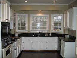 I want to update the kitchen by painting the cabinets or having them refaced in a creamy white. Uba Tuba Granite Countertops Pictures Cost Pros Cons