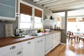 Antique white cabinets paired with black appliances for modern look. Charles Hudson Trucks Tools Travel And Gear Metal Kitchen Cabinets Butcher Block Countertops Kitchen Remodel