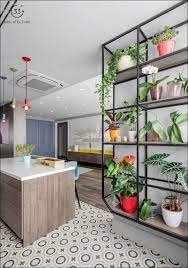 Ideal shelf for displaying your flowers and plants. A Wall Mounted Plant Stand Extends All The Way Up To The Ceiling Allowing For A Huge Collection Of Interesting Hou Apartment Plants House Of Gold House Design