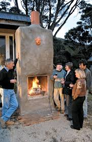 The red brick and gray stones are covered with white wash to give the finished fireplace a uniform appearance. Build An Outdoor Fireplace The Shed