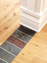 Use A Row Of Natural Tiles To Create A Unique Transition Between Two Rooms Hardwood Floors Flooring Natural Tile Remodel Bedroom