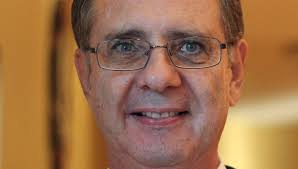 Former county manager booked in battery case