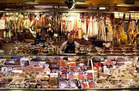 A Butcher One Of Many Vendors At La Boqueria Market Prepares Meat Behind The Counter Meat Shop Supermarket La Boqueria