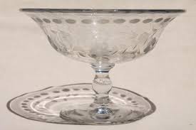 The only flaws on the piece are on the inner rim, where there are four small, very shallow chips that are on the inner. Crystal Clear Vintage Elegant Glass Compote Bowl Etched Cut Dots Flowers
