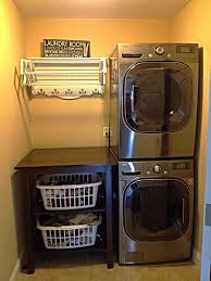 Finished Laundry Room Washer Dryer Stacked To Create Room For Folding Table Basket Storage Stan Laundry Room Diy Farmhouse Laundry Room Laundry Room Storage