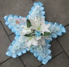Maybe you would like to learn more about one of these? Star Funeral Flowers Elm Park Florists 01708 505520