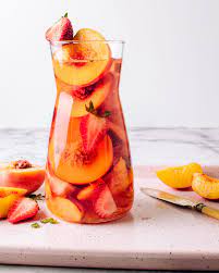 Best Ever Rose Sangria Recipe With Fresh Peaches Foodess Recipe Fresh Peach Recipes Rose Sangria Sangria Recipes