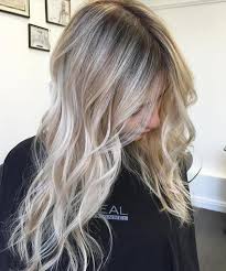 Beach blonde highlights are sprinkled lightly throughout the top portion of the hair in this easy hairstyle. 75 Hot Platinum Blonde Hairstyles For Your Next Salon Appointment Bun Braids