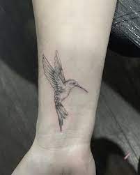 Fine Line Hummingbird Wrist Tattoo In 2021 Hummingbird Tattoo Tattoos Shoulder Tattoos For Women