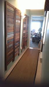 A Reclaimed Wood Room Divider Was Unassembled And Hung On Hallway Walls For Added Interest A Sisal Runner Ad Wood Room Divider Room Divider Cottage Renovation