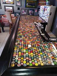 Have A Ton Of Bottle Csps Not Sure What To Do With Them All Here Is A Idea Epoxy Bar Top Bottle Caps Diy Table Top Bottle Top Tables Bar Top