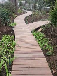 Both the seeds and the leaves are edible. Curved Garden Walkway By Www Prodecking Co Za Backyard Landscaping Designs Backyard Front Door Landscaping