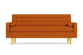We can already imagine our iphone getting lost in those comfy cushions. How To Use A Burnt Orange Sofa In Your Living Room Apartment Therapy