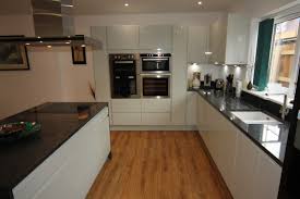 Maybe you would like to learn more about one of these? White Gloss Kitchen With Black Granite Worktops Worcester Diamond Kitchens Driotwich
