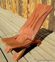 this chair is carved from one peice of wood no nails no glue nothing but carved wood log chairs wood chair chair