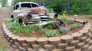 Antique Car Lawn Art In The Landscaping Giving This Old Chevy A Second Chance To Shine All It Needs Is The Rust In Peace Sign Lawn Art Yard Art Garden Art