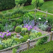 Ornamental Herb Garden An Extremely Charming Fenced Herb Garden Is Elevated To Stunning With The Addit Herb Garden Design Cottage Garden Design Cottage Garden