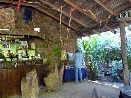 Mock up poster frame in tropical bedroom interior background, modern caribbean style. Interior Room Design And Architecture Of Caribbean Indoor Locations