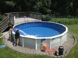 Up Ground Pools Dads Filling Up Their Brand New Hard Sided Above Ground Swimming Pool Above Ground Swimming Pools Best Above Ground Pool Pool Installation