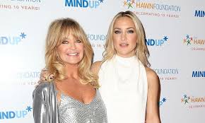 The daughter of goldie hawn rocked an androgynous look as she sported a blue shirt under the stylish coat and added black pants and flats to. Kate Hudson Interviews Goldie Hawn About Her Career In Hollywood Hello Canada