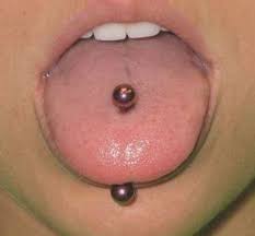 A Traditional Tongue Piercing Goes Straight Through The Tongue Piercing P Piercings Unique Tongue Piercing Unique Ear Piercings