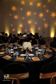 Birthday Decoration Ideas At Home Black And Gold Custom Star Gobo Lighting Projected On A Wall During An Awards Ceremony Black And Gold Color Theme Black Gold Party Hollywood Party Theme Prom Decor