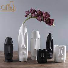 Vases can have many purposes besides simply holding flowers. China Abstract Black White Ceramic Vase For Dry Flower Human Face Decoration Photos Pictures Made In China Com