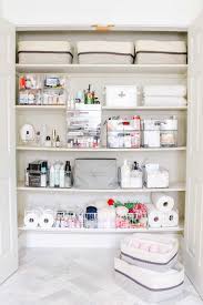 Gels, sprays, curlers, combs and hair dryers take up a lot of space in the bathroom. Linen Closet Organization Makeover Modern Glam