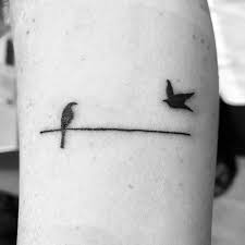 Bird On A Wire Meaning Bird On A Wire Tattoo Day 1 Birds Tattoo Tattoos Trendy Tattoos
