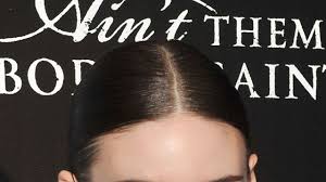 Her part is perfectly level and free of loose hairs, a look achieved by using a straight edge to guide the comb as the hair is parted and by going over the same part several times if necessary. Rooney Mara Presents How To Wear Blush When You Re Not A Blushing Beauty Type Glamour