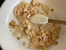 How do you toast flaked almonds in a frying pan?