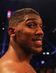 Anthony Joshua beats Carlos Takam by TKO to retain world heavyweight titles 