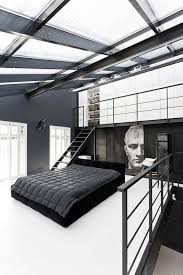 A sophisticated medium sized room with black floors, black mounted cabinets, and modern accents of white and silver. Luxury Goals On Twitter Minimalist Bedroom Design Interior Architecture Design Remodel Bedroom