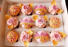 The blush pink creation appears to be a classic chocolate cupcake topped with pink and white frosting designed in a rosy fashion, along with gold edible pearls and a baby pink set of mouse ears. Pink Gold Cupcakes Cake By Kate Cakesdecor