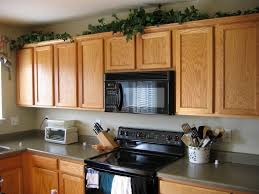 Image Of Greenery Above Kitchen Cabinets Online Above Kitchen Cabinets Decorating Above Kitchen Cabinets Top Kitchen Cabinets