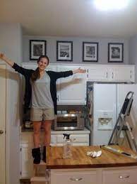 Fill The Annoying Above Cabinet Space In Our Kitchen W Black And Whites Of Fave Memories Defini Decorating Above Kitchen Cabinets Above Kitchen Cabinets Home