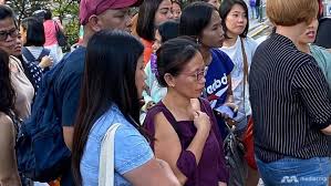 I pray their souls will go to heaven': One week after fatal Lucky Plaza  accident, many come to pay respects