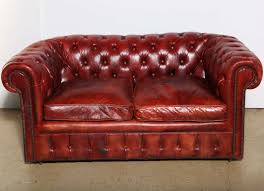 Featuring button tufted cushions with nail head trim borders, this fabric sofa set free local delivery. Mahogany Red Leather Chesterfield Sleeper Sofa And Loveseat At 1stdibs