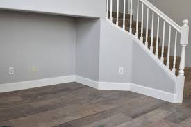 Repose Gray Paint Tall Baseboards Porcelain Tile Floors That Look Like Wood House Flooring Grey Wood Tile Grey Flooring