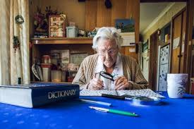 You must turn this feature on in order to use it. Image Of Old Lady At Dining Table With Crossword Magnifying Glass Dictionary And Cup Of Tea Austockphoto